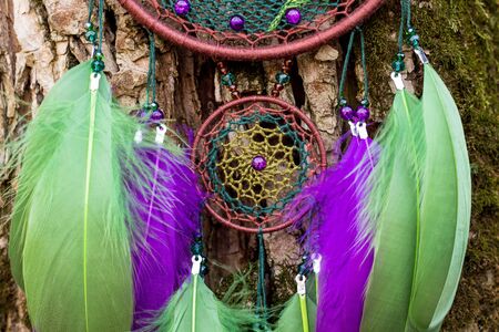 Dream catcher with feathers threads and beads rope hanging. Dreamcatcher handmadeの写真素材
