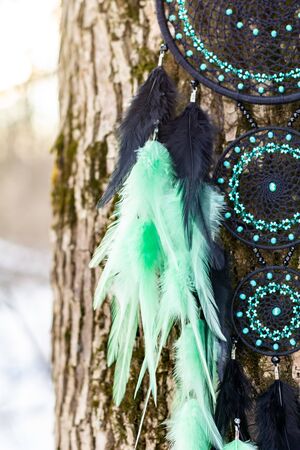 Dream catcher with feathers threads and beads rope hanging. Dreamcatcher handmadeの写真素材