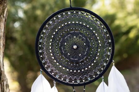 Dream catcher with feathers threads and beads rope hanging. Dreamcatcher handmade
