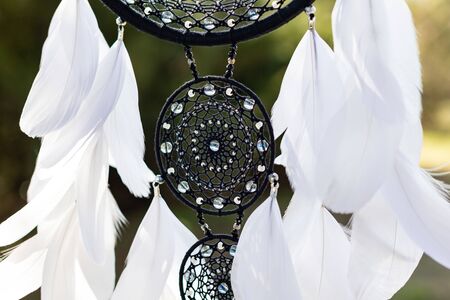 Dream catcher with feathers threads and beads rope hanging. Dreamcatcher handmadeの写真素材