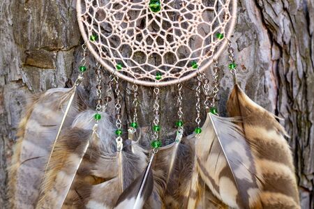 Dream catcher with feathers threads and beads rope hanging. Dreamcatcher handmadeの写真素材
