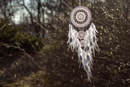 Dream catcher with feathers threads and beads rope hanging. Dreamcatcher handmade