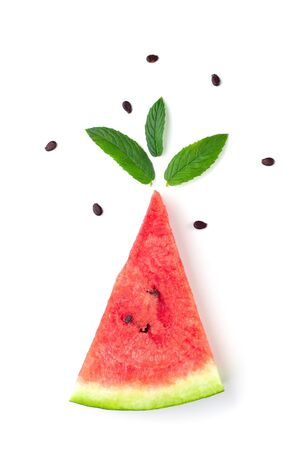 Slice of watermelon with seeds and mint leaves isolated on white background. Summer conceptの写真素材
