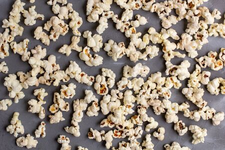 Popcorn pattern on grey stone background. Top view.の写真素材