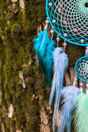 Dream catcher with feathers threads and beads rope hanging. Dreamcatcher handmadeの写真素材