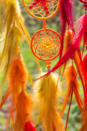 Dream catcher with feathers threads and beads rope hanging. Dreamcatcher handmade