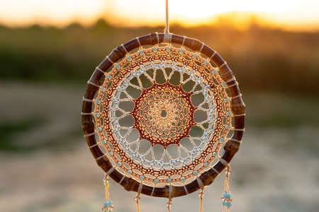 Dream catcher with feathers threads and beads rope hanging. Dreamcatcher handmade