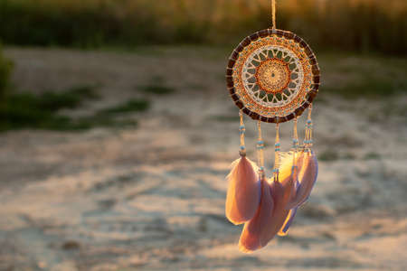 Dream catcher with feathers threads and beads rope hanging. Dreamcatcher handmade