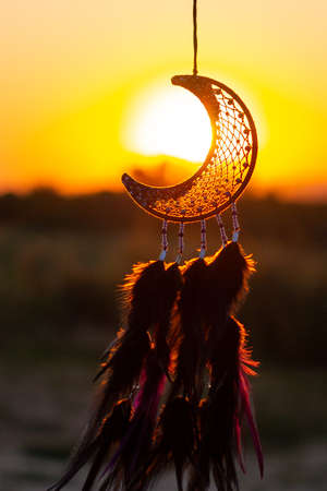 Dream catcher with feathers threads and beads rope hanging. Dreamcatcher handmadeの写真素材