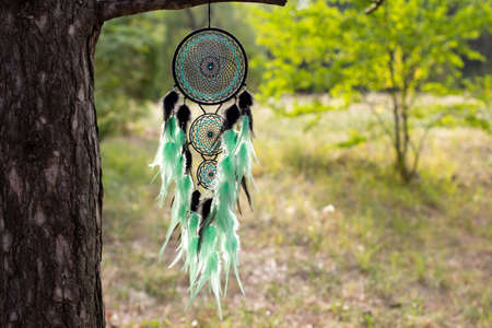 Dream catcher with feathers threads and beads rope hanging. Dreamcatcher handmade