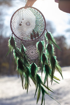 Dream catcher with feathers threads and beads rope hanging. Dreamcatcher handmade
