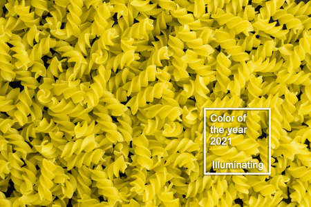 Background of many pile of pasta spiral fusilli. Color of the year 2021