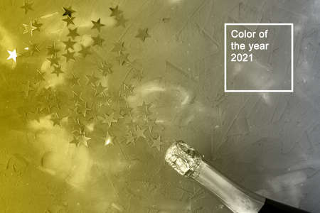 Champagne bottle with gold confetti stars. Concept for christmas, new year, birthday or wedding....