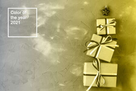 gift boxes in the shape of a Christmas tree with a red star. Christmas celebration concept. Color of...