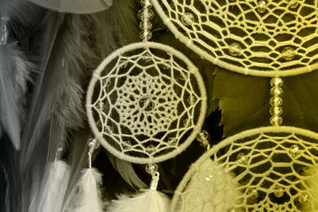 Dream catcher with feathers threads and beads rope hanging. Dreamcatcher handmade. Color of the year 2021の写真素材