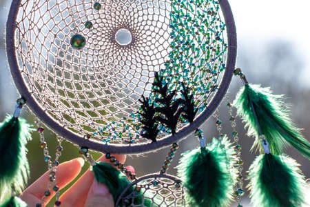 Dream catcher with feathers threads and beads rope hanging. Dreamcatcher handmadeの写真素材