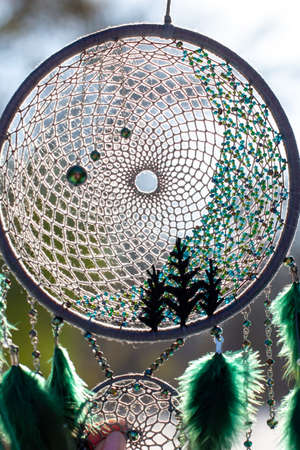 Dream catcher with feathers threads and beads rope hanging. Dreamcatcher handmade
