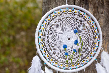 Dream catcher with feathers threads and beads rope hanging. Dreamcatcher handmade