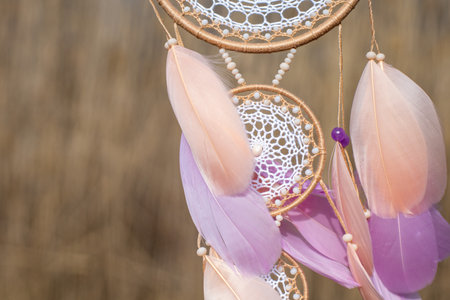 Dream catcher with feathers threads and beads rope hanging. Dreamcatcher handmadeの写真素材