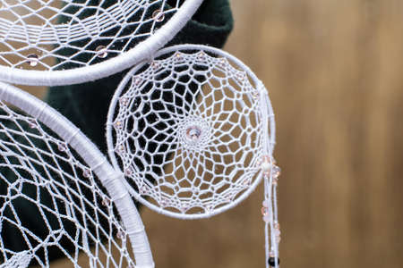 Dream catcher with feathers threads and beads rope hanging. Dreamcatcher handmade