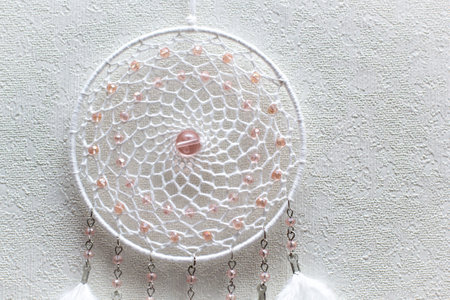 Dream catcher with feathers threads and beads rope hanging. Dreamcatcher handmadeの写真素材