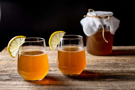 Raw fermented homemade alcoholic or non alcogolic kombucha superfood. Ice tea with healthy natural...