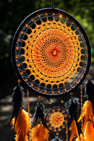 Dream catcher with feathers threads and beads rope hanging. Dreamcatcher handmadeの写真素材