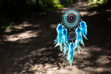 Dream catcher with feathers threads and beads rope hanging. Dreamcatcher handmadeの写真素材