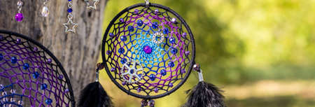 banner of Dream catcher with feathers threads and beads rope hanging. Dreamcatcher handmade