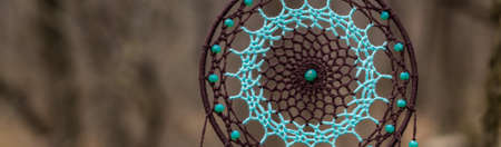banner of Dream catcher with feathers threads and beads rope hanging. Dreamcatcher handmade