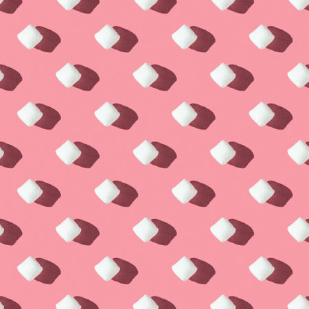 seamless pattern of white marshmallow on a pink background with hard lightの写真素材