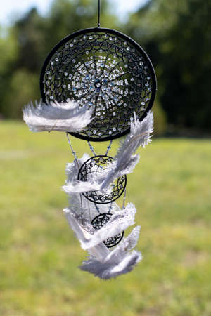 Dream catcher with feathers threads and beads rope hanging. Dreamcatcher handmade