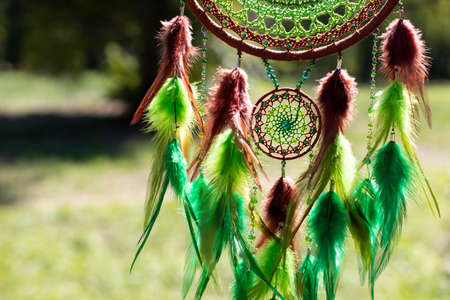 Dream catcher with feathers threads and beads rope hanging. Dreamcatcher handmade