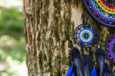 Dream catcher with feathers threads and beads rope hanging. Dreamcatcher handmadeの写真素材