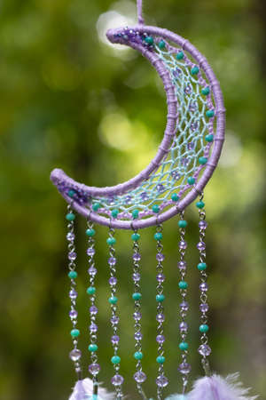 Dream catcher with feathers threads and beads rope hanging. Dreamcatcher handmadeの写真素材
