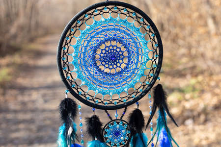Dream catcher with feathers threads and beads rope hanging. Dreamcatcher handmadeの写真素材