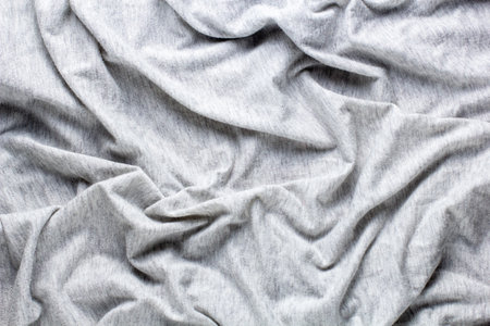 Gray crumpled fabric background for your design. Knitwear cotton abstract texture patternの写真素材