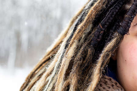 woman head with dreadlocks. Close up artificial ombre dreadlocks in natural colorの写真素材