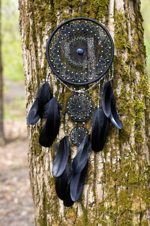 Dream catcher with feathers threads and beads rope hanging. Dreamcatcher handmadeの写真素材
