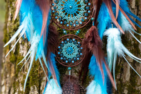 Dream catcher with feathers threads and beads rope hanging. Dreamcatcher handmade