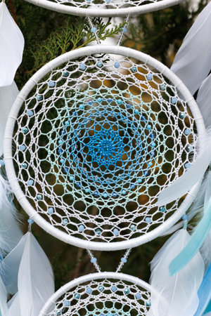 Dream catcher with feathers threads and beads rope hanging. Dreamcatcher handmadeの写真素材