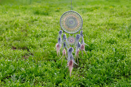 Dream catcher with feathers threads and beads rope hanging. Dreamcatcher handmade