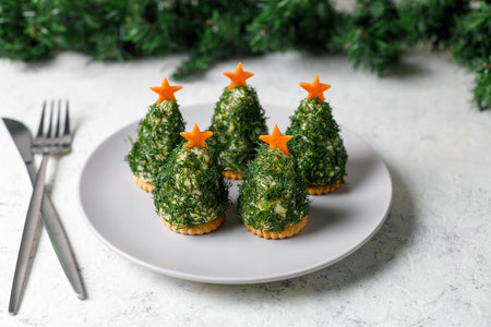 Festive salad of dill cheese and cookies in the form of a Christmas tree. Holiday appetizer in the form of christmas treeの写真素材