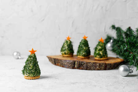 Festive salad of dill cheese and cookies in the form of a Christmas tree. Holiday appetizer in the form of christmas treeの写真素材