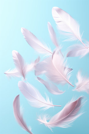 white feathers fly in the air on blue pastel background. Trendy levitationの素材