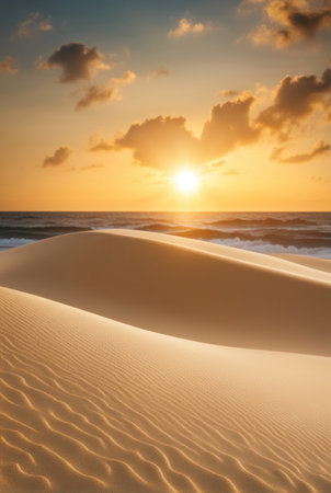 Sand dunes leading to a calm ocean, with a soft sunrise illuminating the sceneの素材