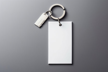 A simple, clean keychain with a white tag, ready for branding.の素材