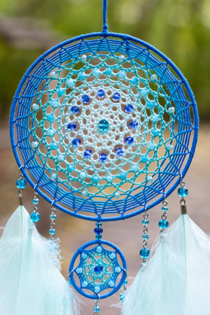 Dream catcher with feathers threads and beads rope hanging. Dreamcatcher handmadeの写真素材