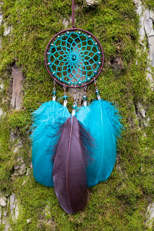 Dream catcher with feathers threads and beads rope hanging. Dreamcatcher handmadeの写真素材