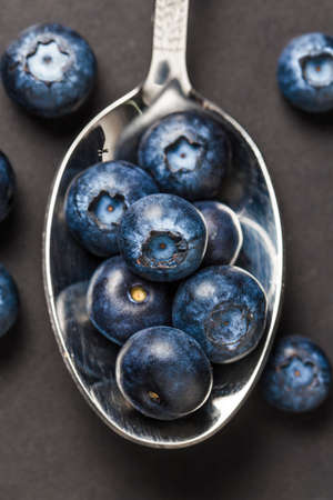Close up to blueberry on a spoonの写真素材